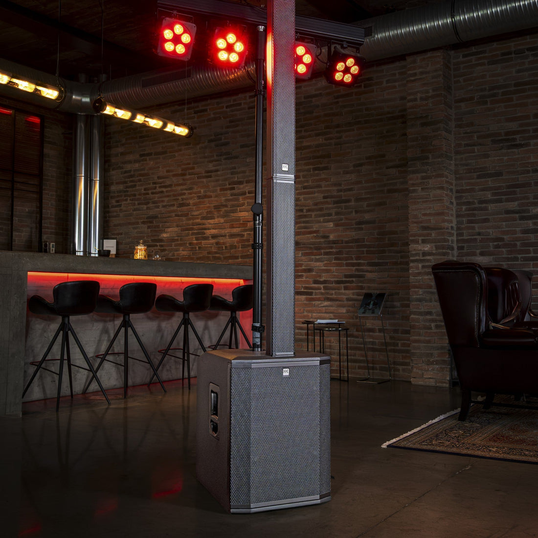 HK Audio POLAR 15 MK2 column PA in a bar with stage lighting