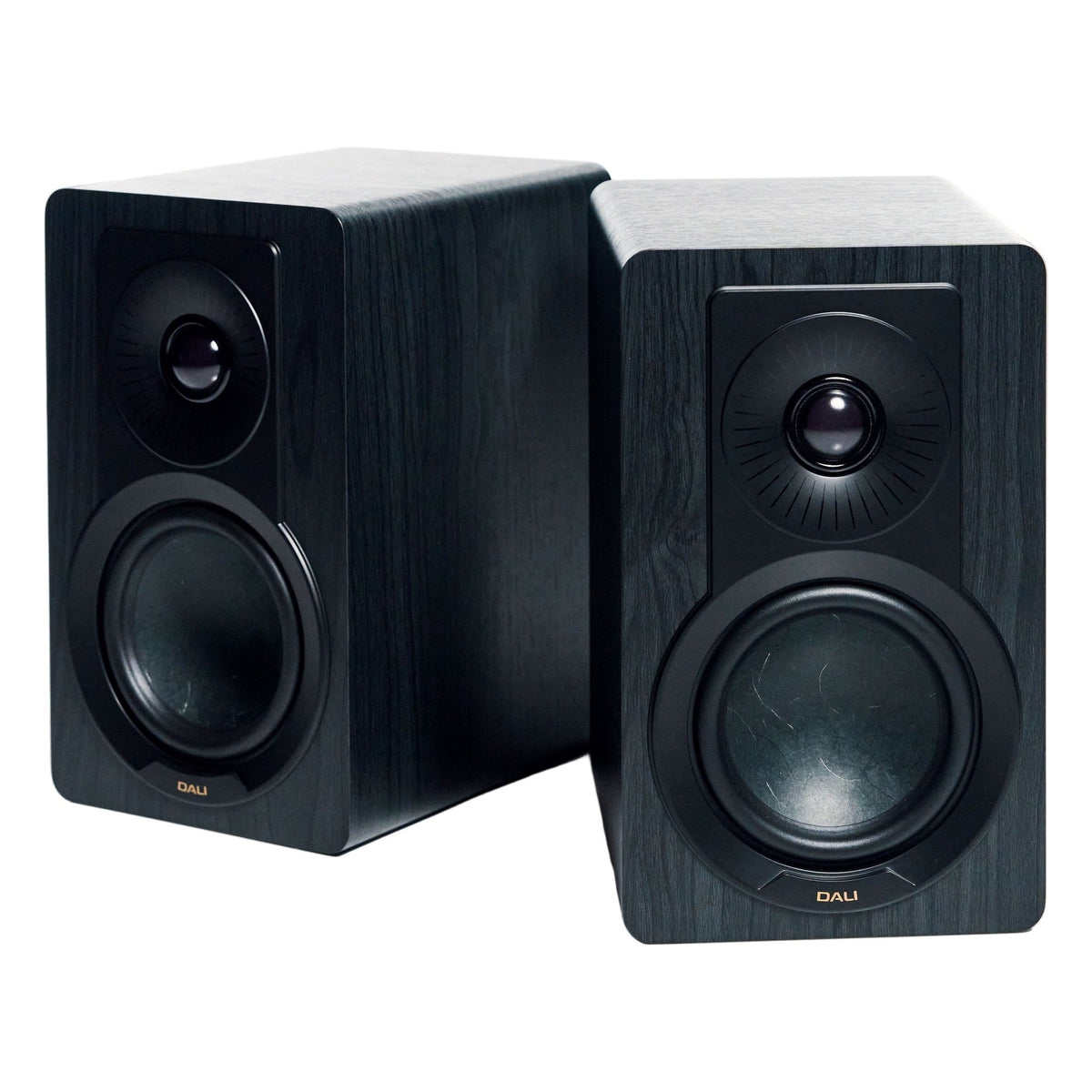 DALI Kupid passive bookshelf speakers shown with sleek black cabinets and compact design for high-quality audio performance.