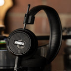 Grado Signature S150 headphones next to a turntable
