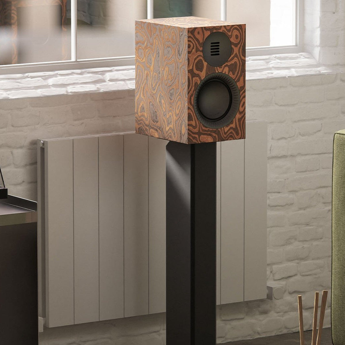Kanto Audio TUK G2 powered speaker in Matte Burl on a stand in a living room