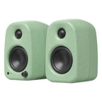 Kanto Audio UKI desktop speakers shown from front perspective, compact design with black finish and control knobs on top.