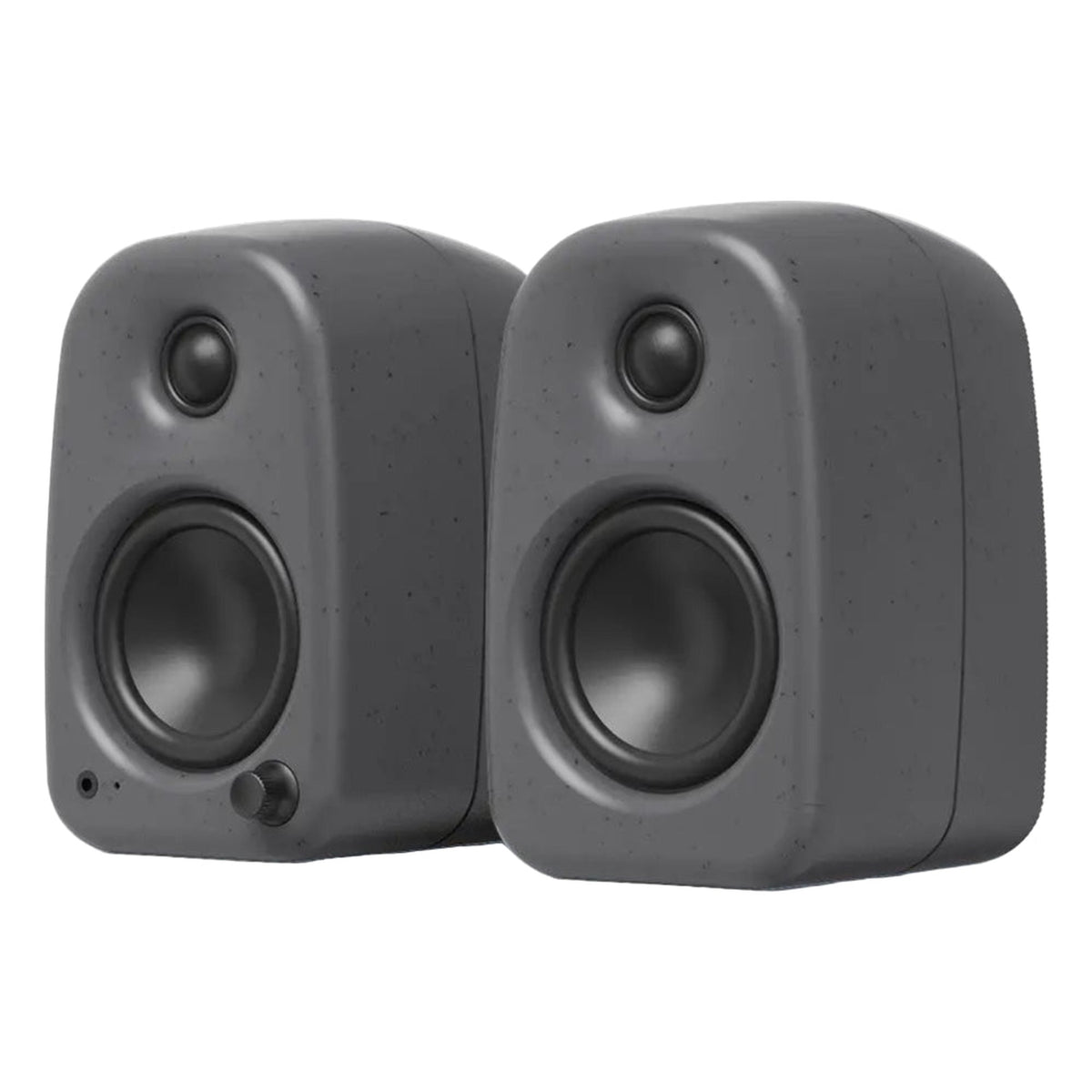 Kanto Audio UKI desktop speakers with sleek black finish and front speaker grille, designed for high-quality audio on a desk.