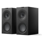 Pair of KEF Q Concerto Meta passive bookshelf speakers with sleek black cabinets and detailed driver grilles, ideal for home audio.