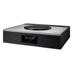 Technics SA-C600 stereo amplifier with control knobs, display screen, and input ports on a sleek black finish.