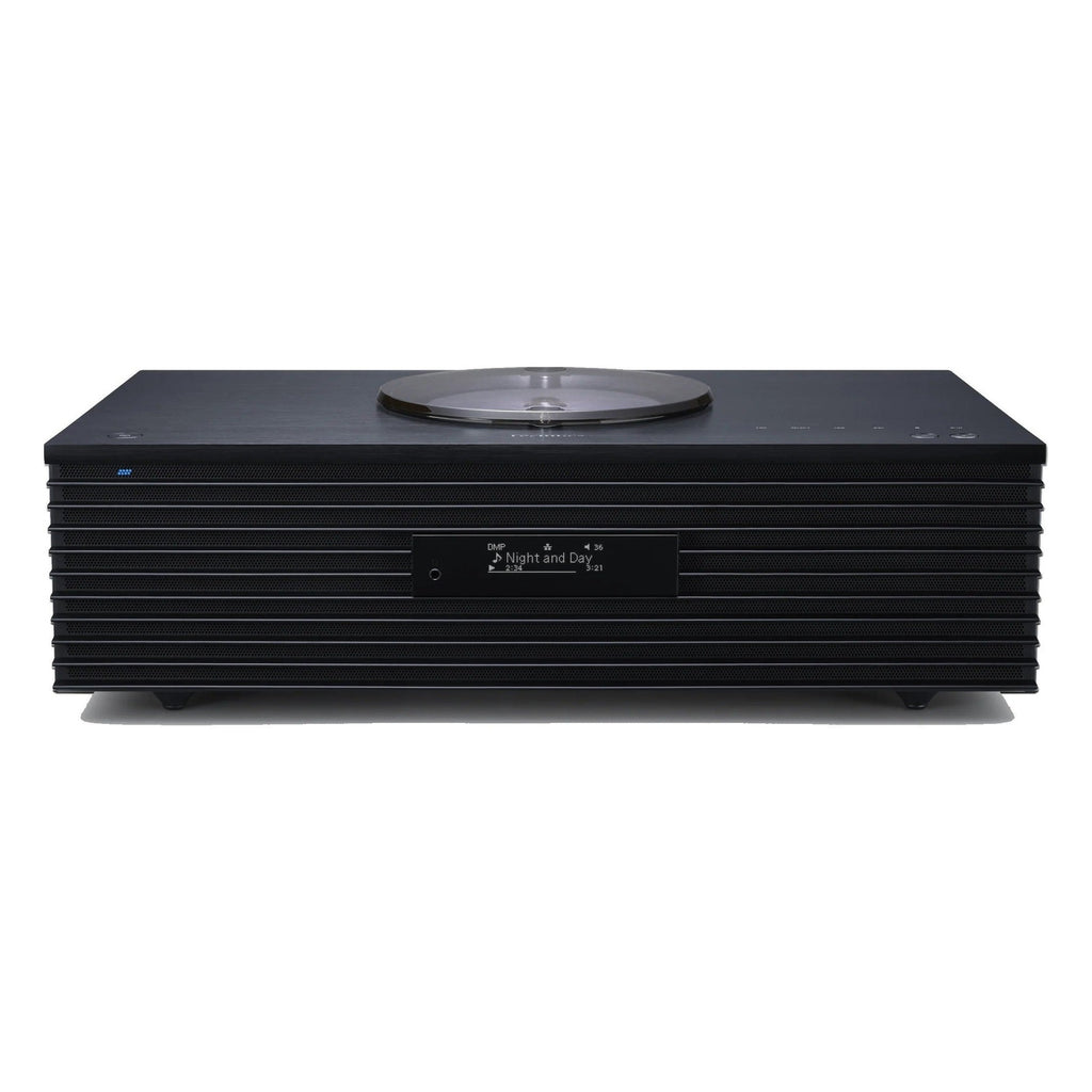 Technics SC-C70MK2 CD player with sleek design, digital display, and control buttons on top, in a modern home audio setup.